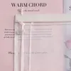 A close-up of a transparent curtain with text printed on the background paper. Produktbild-Vorschau