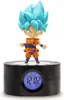 A figurine of Goku from Dragon Ball standing on a digital alarm clock. Voir les images du produit