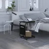 A bedroom scene with a bed, nightstand, and a side table next to the bed. Náhľad obrázku produktu