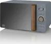 A studio shot of a gray digital microwave with a wooden handle and control knob, reflecting on a white surface. Náhled obrázku produktu