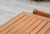 Close-up of wooden slats of a table and a partial view of a chair back. Produktbild-Vorschau