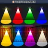 A collage of images showing solar fence lights projecting different colored lights onto wooden fences and surfaces. Produktbild-Vorschau