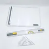 A white drafting board with a parallel ruler and a triangle ruler on a white background. Náhľad obrázku produktu