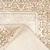 A close-up view of a folded rug, showing its intricate pattern and texture. Produktbild-Vorschau