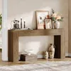 A console table with decorative items on top and below, set in a room with a textured wall and wooden floor. Podgląd zdjęcia produktu