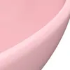 A close-up view of the edge of a pink ceramic sink. Podgląd zdjęcia produktu