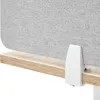 A close-up view of a desk divider attached to a wooden desk with a white clamp. Náhled obrázku produktu