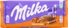 A Milka Toffee Creme chocolate bar wrapper with a depiction of the chocolate bar and a cow. Podgląd zdjęcia produktu