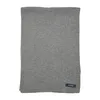 A gray knitted scarf is laid flat against a white background. Anteprima dell’immagine prodotto