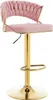 A pink velvet bar stool with a gold base and adjustable height.