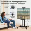 A couple is sitting on a couch watching a TV mounted on a rolling stand. The stand has adjustable height and mounting options. Náhled obrázku produktu