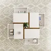 A top-down view of a modern coffee table with open drawers, placed on a patterned rug. Náhľad obrázku produktu