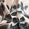 Close-up view of a fabric with a floral pattern. Produktbild-Vorschau