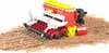 A toy agricultural seeder machine is shown on a pile of dirt and soil. Anteprima dell’immagine prodotto