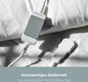 Close-up of a white heated blanket with two control units attached. Produktbild-Vorschau