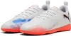 A pair of white Puma soccer shoes with orange soles and colorful accents. Produktbild-Vorschau