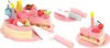 A toy birthday cake with accessories, including candles, fruit slices, and a cake server. Anteprima dell’immagine prodotto