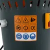 A close-up of a label with safety symbols and CE marking on a gray machine. Náhled obrázku produktu