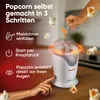 A popcorn machine is shown with steps for making popcorn illustrated with icons and text. Náhled obrázku produktu