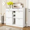A white shoe cabinet with drawers and open shelves, decorated with a vase of yellow flowers and a framed picture. Podgląd zdjęcia produktu