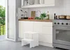 A white step stool is placed in a modern kitchen setting. Produktbild-Vorschau
