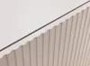 A close-up view of a white furniture piece with a ribbed texture and a dark line separating two sections. Náhled obrázku produktu