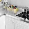 A kitchen counter with a stovetop, cookware, and spices. Produktbild-Vorschau