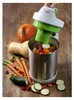 A soup maker with vegetables on a wooden surface. Náhľad obrázku produktu