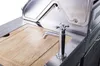 A close-up view of a stainless steel BBQ kitchen with a wooden cutting board and a chrome faucet. Produktbild-Vorschau