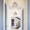 A hallway with two crystal ceiling lights and a staircase in the background. Produktbild-Vorschau