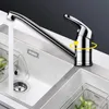 A modern kitchen sink with a chrome faucet and running water. Produktbild-Vorschau