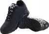 A pair of black Skechers sneakers with gold and white accents. Produktbild-Vorschau