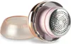 A close-up, angled view of a fabric shaver with its protective cap removed, showing the metallic cutting head and internal components. Anteprima dell’immagine prodotto