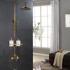 A bathroom scene with a vintage-style shower fixture and soap dispensers, next to a window with curtains and a bench. Náhľad obrázku produktu