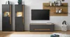 A modern living room setup featuring a TV, media console, and storage cabinets. Produktbild-Vorschau