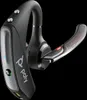 A close-up studio shot of a black Poly Voyager 5200 Bluetooth headset against a black background. Produktbild-Vorschau