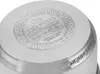 The bottom of a stainless steel pot with embossed text and logos. Náhled obrázku produktu