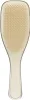 A top-down view of a beige hairbrush with a transparent handle, isolated on a white background. Anteprima dell’immagine prodotto