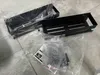 Two black shower shelves are shown in their original plastic packaging, along with some accessories and instructions. Anteprima dell’immagine prodotto