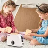 Two young girls playing with a toy toaster and toast slices inside a play tent. Anteprima dell’immagine prodotto