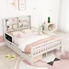 A child's bed with a bookshelf headboard and storage drawers, set in a bedroom with decorative elements. Náhľad obrázku produktu