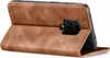 A brown leather flip case for a smartphone is shown standing upright. Produktbild-Vorschau