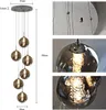 A multi-light pendant lamp with glass globes, shown with dimensions. Anteprima dell’immagine prodotto