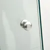 A close-up of a silver knob on a glass surface. Produktbild-Vorschau