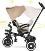A side view of a beige and black baby tricycle with a canopy, showing its 360-degree rotating seat feature. Produktbild-Vorschau