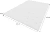 A white mattress topper with a textured surface is shown from a diagonal angle. Produktbild-Vorschau