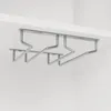 A silver metal wine glass rack mounted under a white surface. Anteprima dell’immagine prodotto