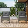 A rattan balcony set with two chairs and a small table on a wooden deck, surrounded by plants. Podgląd zdjęcia produktu