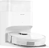 A white robot vacuum cleaner docked in its charging station. Produktbild-Vorschau