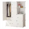 A white modular wardrobe with clothes hanging inside and decorative items on shelves. Produktbild-Vorschau